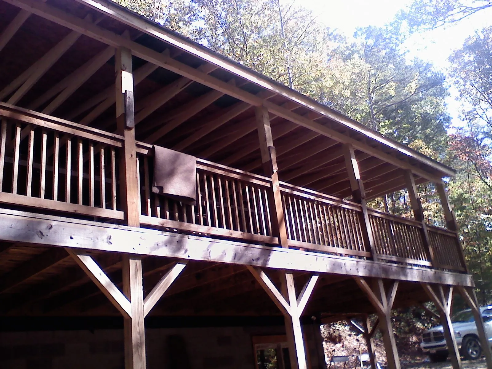 Timber framing under a new elevated porch and deck — Roof Leak Repair in East Moline by Roofing Brothers